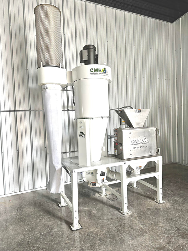 Large white mill machine in a room with metal walls