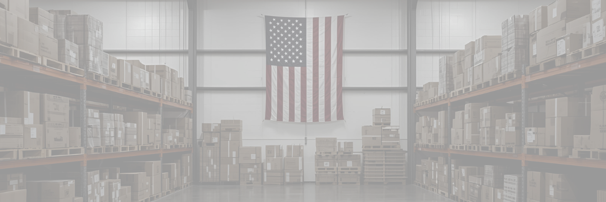 Warehouse interior with boxes on shelves and an American flag hanging up in the middle