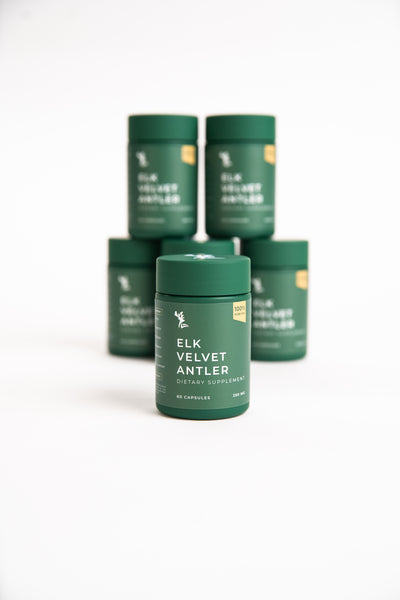 Green supplement containers, stacked, on white background